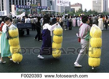 Stock Photo - south korea,  
seoul,  buying 
paper lanterns 
for buddha's birthday. 
fotosearch - search 
stock photos, 
pictures, images, 
and photo clipart