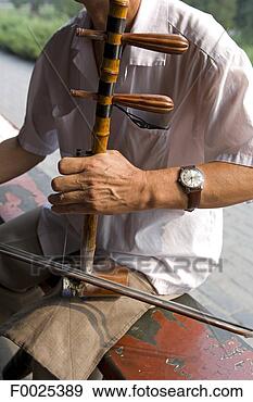 Stock Photograph - china, beijing, 
erhu player. fotosearch 
- search stock 
photos, pictures, 
images, and photo 
clipart