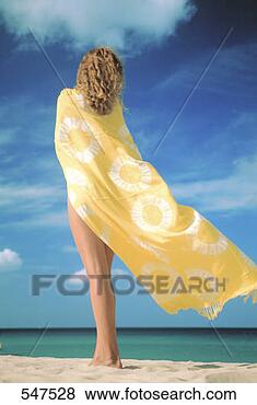 Stock Photo - young woman draped  in beach towel   thailand. fotosearch  - search stock  photos, pictures,  images, and photo  clipart