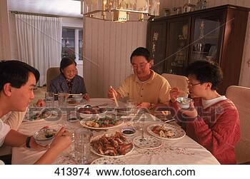 Stock Photo - family eating 
traditional chinese 
meal. fotosearch 
- search stock 
photos, pictures, 
images, and photo 
clipart