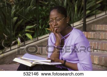 Stock Photo - graduate student 
outdoor on the 
univ campus. fotosearch 
- search stock 
photos, pictures, 
images, and photo 
clipart