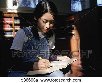Stock Photography - student in univ 
library  ca. fotosearch 
- search stock 
photos, pictures, 
images, and photo 
clipart