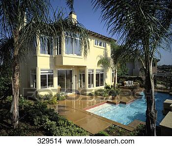 Stock Photo - arch067 exterior 
of home with pool 
 ca. fotosearch 
- search stock 
photos, pictures, 
images, and photo 
clipart