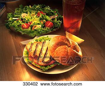 Stock Photo - fobv074 grilled 
ahi sandwich and 
salad. fotosearch 
- search stock 
photos, pictures, 
images, and photo 
clipart