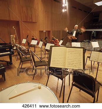 Stock Photography - conductor & orchestra 
instruments. fotosearch 
- search stock 
photos, pictures, 
images, and photo 
clipart