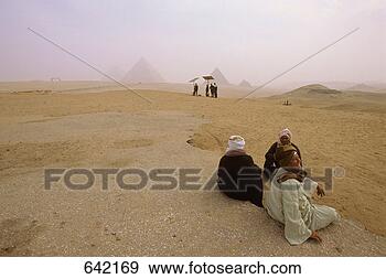 Stock Photograph - 3 camel riders, 
giza pyramids 
view, cairo. fotosearch 
- search stock 
photos, pictures, 
images, and photo 
clipart