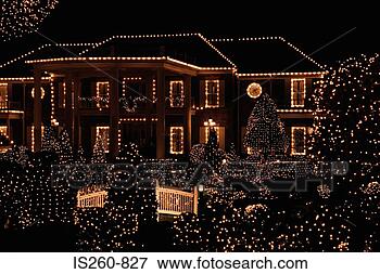 Picture - house illuminated 
by christmas lights. 
fotosearch - search 
stock photos, 
pictures, images, 
and photo clipart