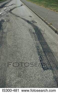 Stock Photography - tyre tracks on 
a road. fotosearch 
- search stock 
photos, pictures, 
images, and photo 
clipart