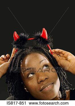 Stock Photography - woman wearing 
devil horns. fotosearch 
- search stock 
photos, pictures, 
images, and photo 
clipart