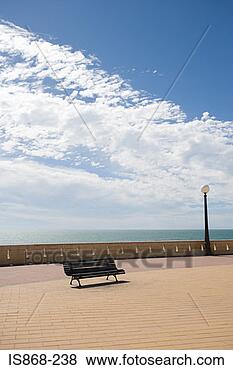 Stock Photo - bench on promenade 
by the sea. fotosearch 
- search stock 
photos, pictures, 
images, and photo 
clipart