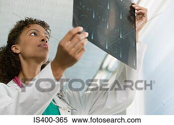 Stock Image - doctor with mri 
scan. fotosearch 
- search stock 
photos, pictures, 
images, and photo 
clipart
