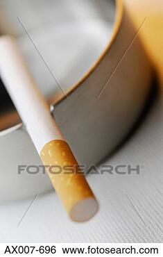 Stock Photo - close-up of a 
cigarette in an 
ashtray. fotosearch 
- search stock 
photos, pictures, 
images, and photo 
clipart