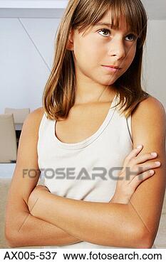 Picture - close-up of a 
girl looking serious. 
fotosearch - search 
stock photos, 
pictures, images, 
and photo clipart