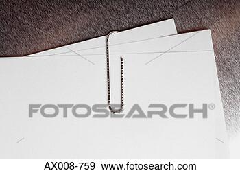 Stock Photograph - close-up of a 
paper clip on 
sheets of paper. 
fotosearch - search 
stock photos, 
pictures, images, 
and photo clipart
