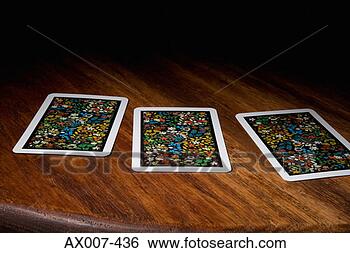 Stock Photo - close-up of three 
cards on a table. 
fotosearch - search 
stock photos, 
pictures, images, 
and photo clipart