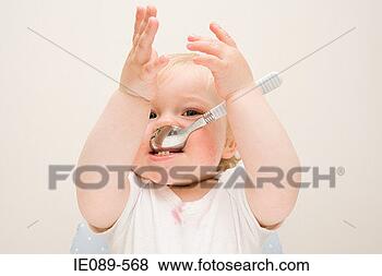 Stock Photo - a baby boy chewing 
on a spoon. fotosearch 
- search stock 
photos, pictures, 
images, and photo 
clipart
