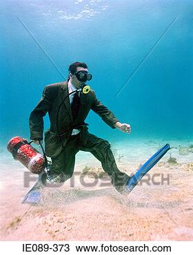 Stock Photo - scuba diving businessman 
underwater. fotosearch 
- search stock 
photos, pictures, 
images, and photo 
clipart