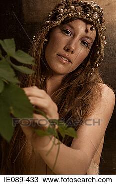 Stock Photo - young woman wearing 
headdress. fotosearch 
- search stock 
photos, pictures, 
images, and photo 
clipart