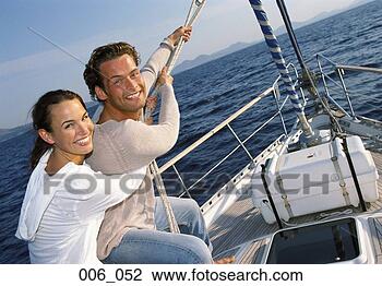 Stock Photo - couple on sailing 
boat. fotosearch 
- search stock 
photos, pictures, 
images, and photo 
clipart