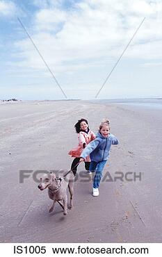 Stock Image - girls on beach. 
fotosearch - search 
stock photos, 
pictures, images, 
and photo clipart