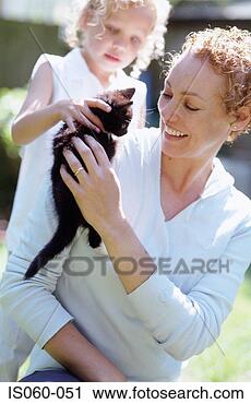 Stock Photography - mother and daughter 
with cat. fotosearch 
- search stock 
photos, pictures, 
images, and photo 
clipart