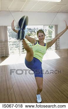 Stock Photo - woman kick-boxing. 
fotosearch - search 
stock photos, 
pictures, images, 
and photo clipart