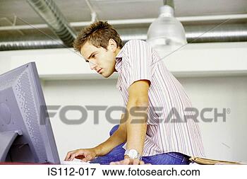 Picture - man using computer. 
fotosearch - search 
stock photos, 
pictures, images, 
and photo clipart