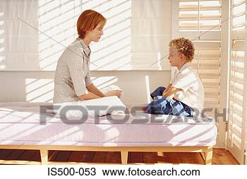 Stock Photo - mother and son 
on bed. fotosearch 
- search stock 
photos, pictures, 
images, and photo 
clipart