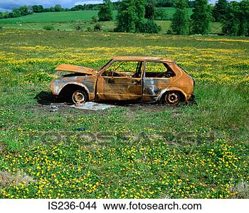 Stock Photo - abandoned car 
in a field. fotosearch 
- search stock 
photos, pictures, 
images, and photo 
clipart