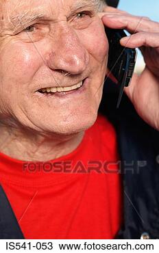 Stock Photo - elderly man smiling 
with cellphone. 
fotosearch - search 
stock photos, 
pictures, images, 
and photo clipart