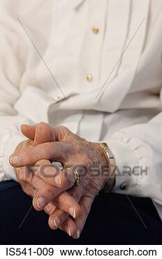 Stock Photograph - hands of an elderly 
woman. fotosearch 
- search stock 
photos, pictures, 
images, and photo 
clipart