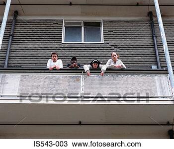Stock Photo - teenagers standing 
on balcony. fotosearch 
- search stock 
photos, pictures, 
images, and photo 
clipart
