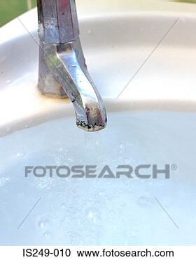 Stock Photography - basin brimming 
with tap water. 
fotosearch - search 
stock photos, 
pictures, images, 
and photo clipart