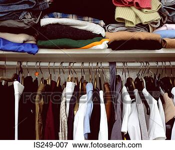 Picture - clothes in cupboard. 
fotosearch - search 
stock photos, 
pictures, images, 
and photo clipart
