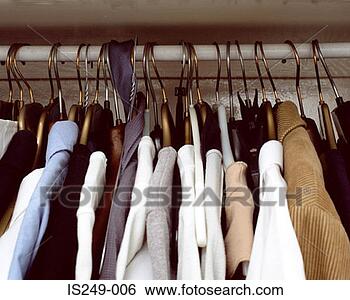 Stock Photo - clothes hanging 
in cupboard. fotosearch 
- search stock 
photos, pictures, 
images, and photo 
clipart