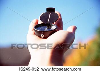 Stock Photo - finding north 
with compass. 
fotosearch - search 
stock photos, 
pictures, images, 
and photo clipart