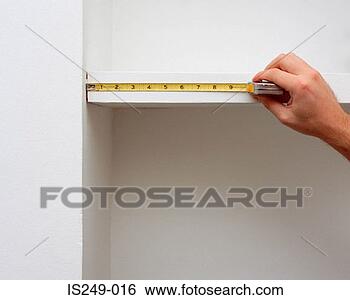 Stock Photo - measuring shelf 
length. fotosearch 
- search stock 
photos, pictures, 
images, and photo 
clipart