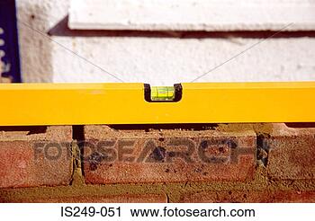 Stock Photography - spirit level on 
brick wall. fotosearch 
- search stock 
photos, pictures, 
images, and photo 
clipart