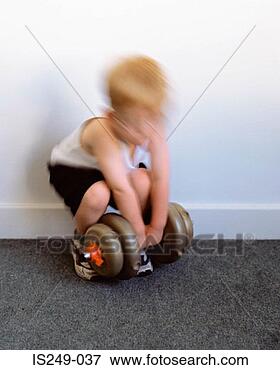 Picture - young boy with 
dumb-bell. fotosearch 
- search stock 
photos, pictures, 
images, and photo 
clipart