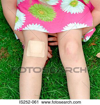 Stock Photography - girl with plaster 
on her knee. fotosearch 
- search stock 
photos, pictures, 
images, and photo 
clipart