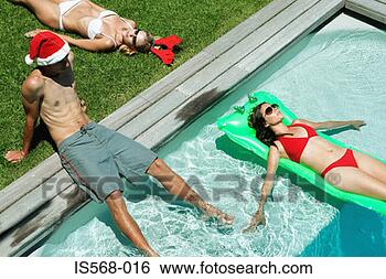 Stock Photo - christmas by the 
swimming pool. 
fotosearch - search 
stock photos, 
pictures, images, 
and photo clipart