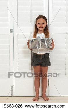 Stock Photo - happy girl holding 
a present. fotosearch 
- search stock 
photos, pictures, 
images, and photo 
clipart