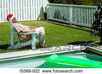 Stock Photo - having a kip by 
the pool. fotosearch 
- search stock 
photos, pictures, 
images, and photo 
clipart