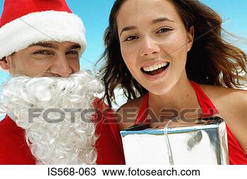 Stock Photo - santa and happy 
young woman. fotosearch 
- search stock 
photos, pictures, 
images, and photo 
clipart