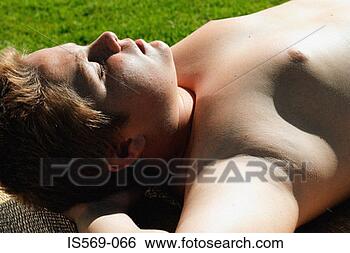 Stock Photo - boy sunbathing. 
fotosearch - search 
stock photos, 
pictures, images, 
and photo clipart