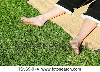 Stock Photo - boy sunbathing. 
fotosearch - search 
stock photos, 
pictures, images, 
and photo clipart