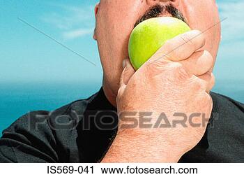 Stock Photography - large man eating 
an apple. fotosearch 
- search stock 
photos, pictures, 
images, and photo 
clipart