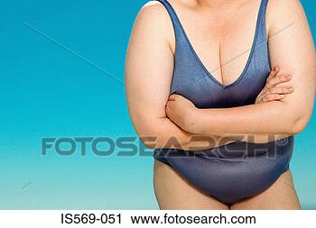 Stock Photography - overweight woman 
in swim suit. 
fotosearch - search 
stock photos, 
pictures, images, 
and photo clipart
