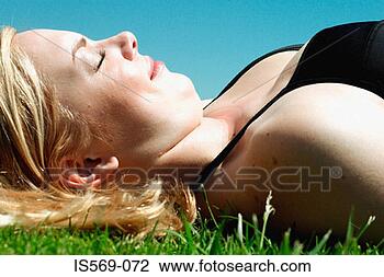 Stock Photo - woman sunbathing. 
fotosearch - search 
stock photos, 
pictures, images, 
and photo clipart