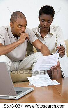 Picture - couple reading 
a document. fotosearch 
- search stock 
photos, pictures, 
images, and photo 
clipart
